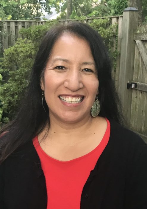 Head shot of Dorothy Lippert in red top, black jacket.