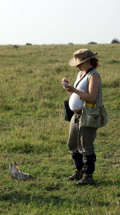 Pregnant Briana doing fieldwork