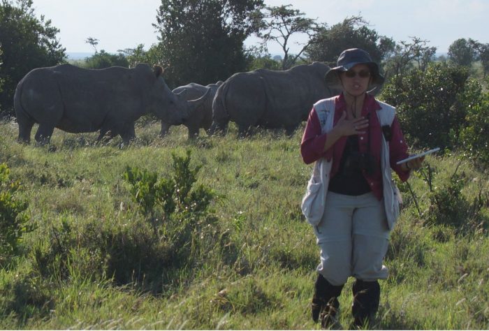 Briana Pobiner with white rhinos