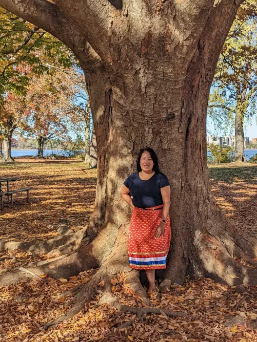 Dorothy Lippert poses in front of giant tree