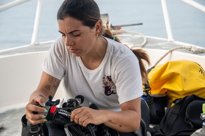 Guzman on boat adjusting equipment