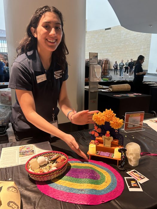 Volunteer showing off her tiny Day of the Dead altar