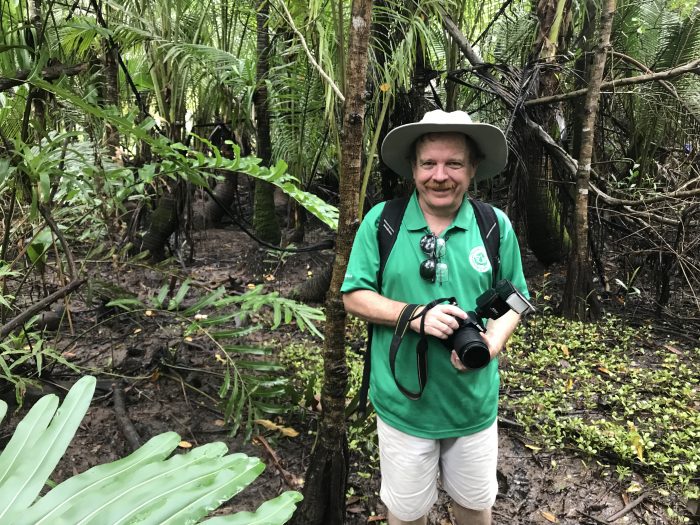 Paton with camera in the jungle