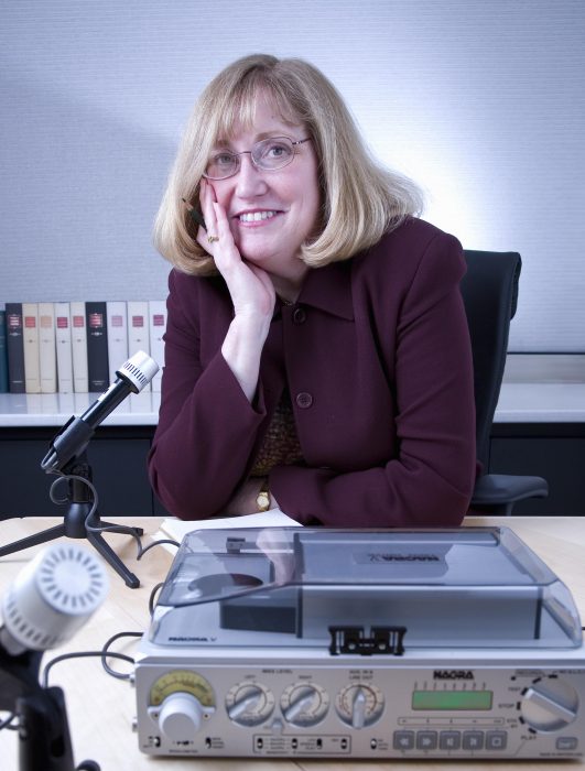 Pam Henson poses with tape recorder and microphone