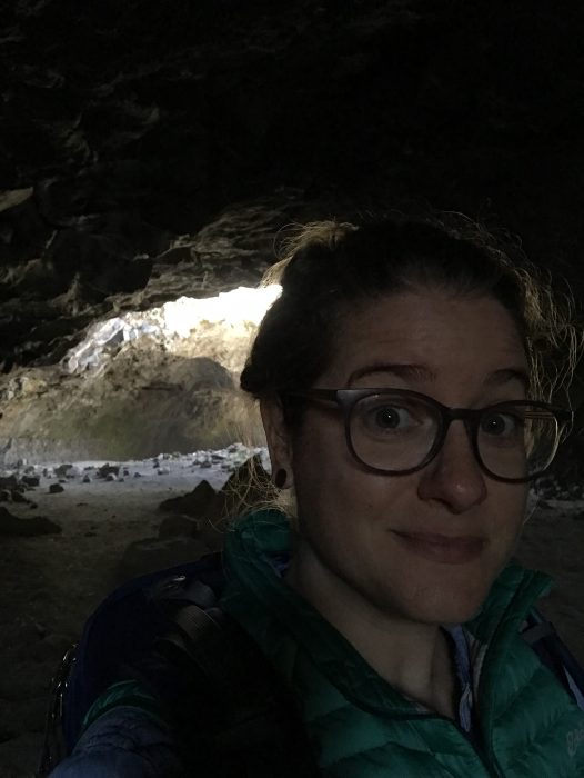 Selfie of Emily Martin in cave-like structure