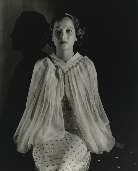 Black and white portrait of Merle Oberon dressed in diaphanous white gown