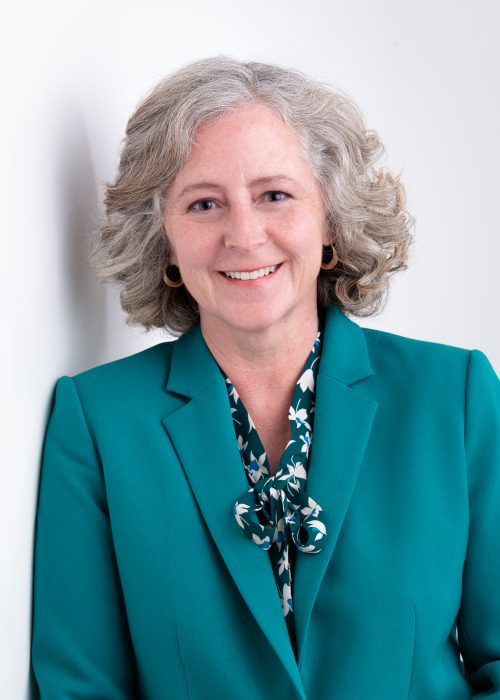 Head shot of Elizabeth Babcock wearing teal suit