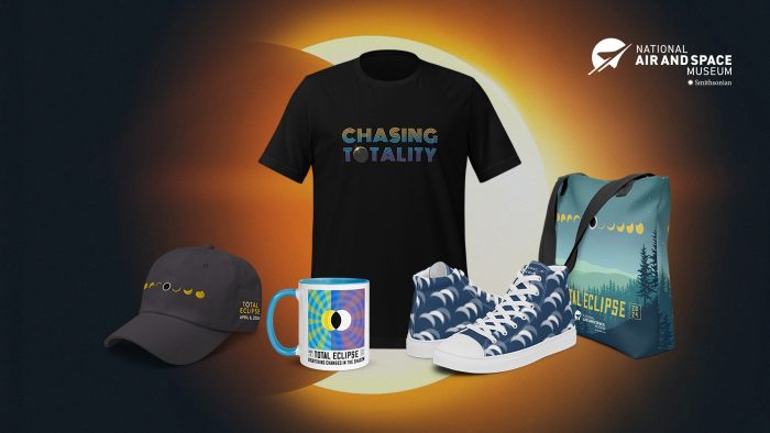 Selection of eclipse-branded merchandise from NASM, including cap, shoes, t-shirt, tote