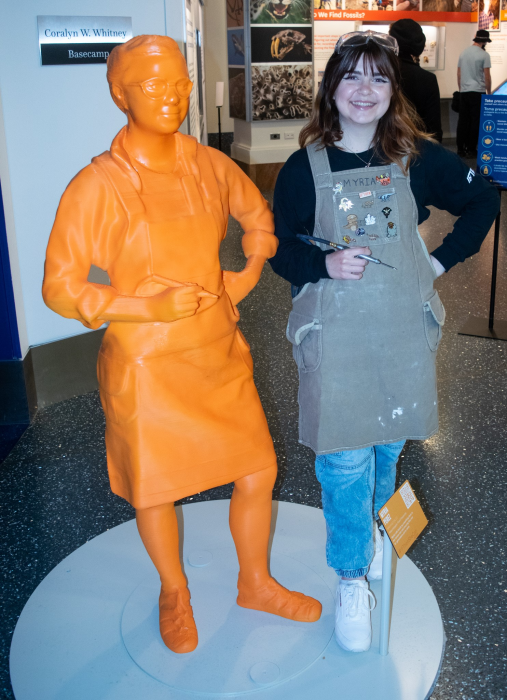 Perez side-by-side with orange plastic statue