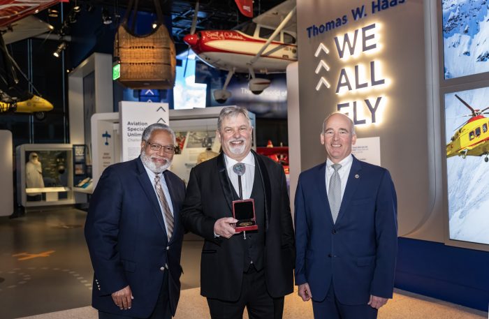 Group shot of Lonnie Bunch, Thomas Haas and Chris Browne with James Smithoni Memorial Medal