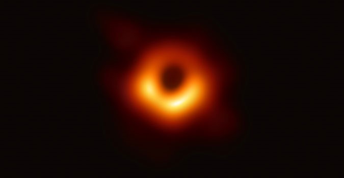 Black hole image showing dark center surrounded by glowing umbra