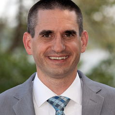 Headshot of curator Frank Blazich