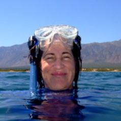 Mary Hagedorn in the water with snorkeling goggles