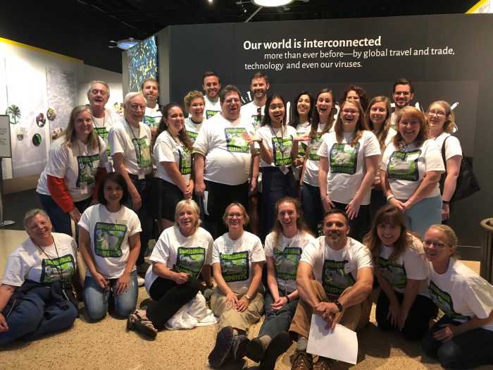 Group shot of volunteers wearing T-shirts with Smithsonian Sleepovers logo