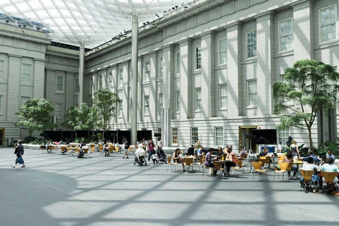 Visitors sit at tables scattered across the Kogod Courtyard at the Smithsonian’s National Portrait Gallery.