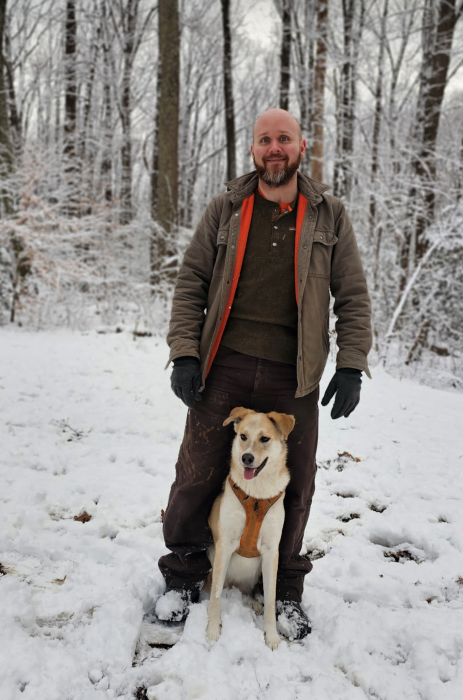 Logan Kistler and his dog Tilly in the snow