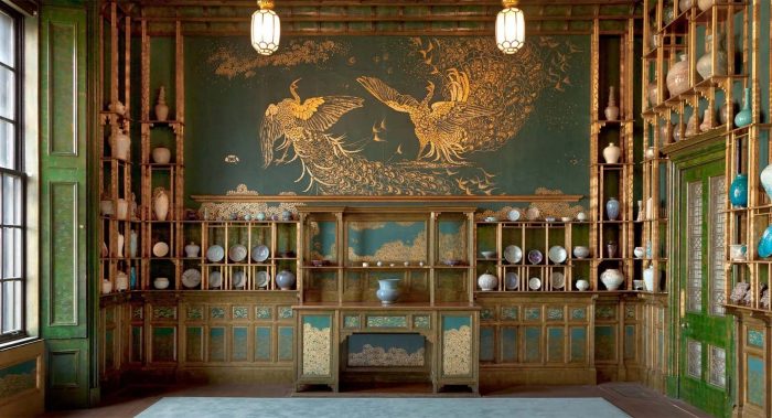 Peacock Room with mural of two gilded peacocks.