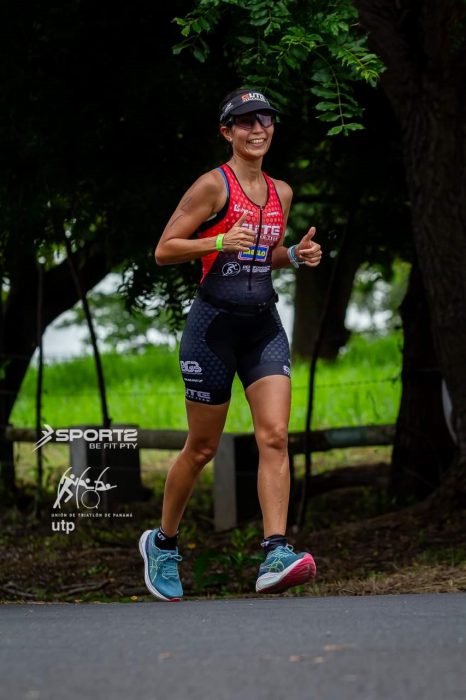 Photo of Anabell Cornejo running a marathon. Watermarks for sponsoring organizations are visible