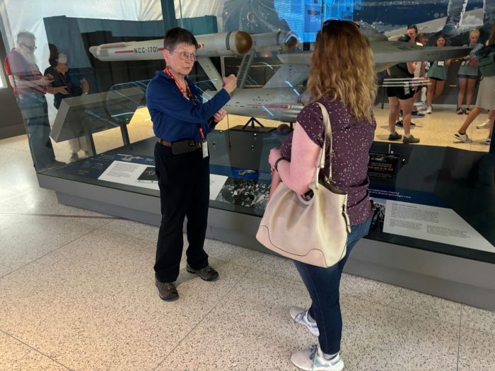 Mary Dominiak talks with a visitor to the Air and Space Museum