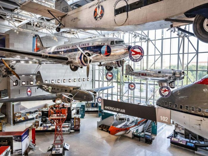 View of aircraft suspended from ceiling in American by Air exhibition