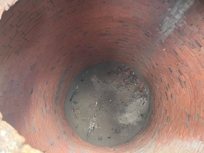 Brick-lined well-like cistern