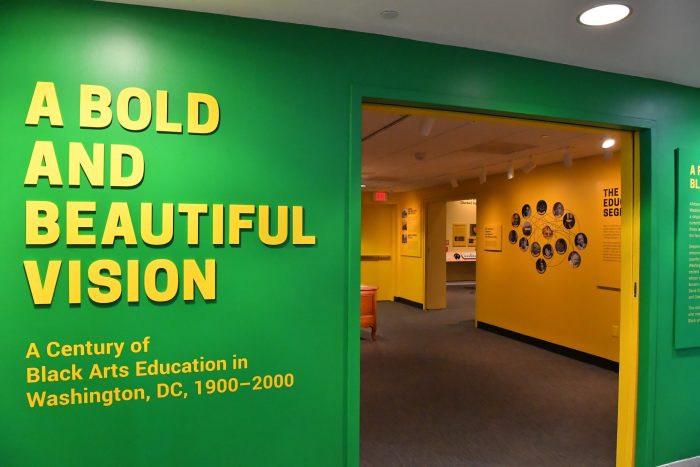 Gallery entrance featuring text A Bold and Beautiful Vision on green background