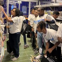 Young people explore the Ravens Bookmobile