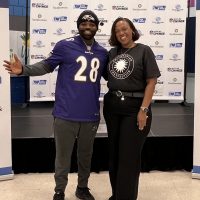 Running back Terrance West and Under Secretary for Education Monique Chism