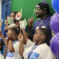 Terrance West and youth from the Boys and Girls Club are ready for their close-ups in the photo booth