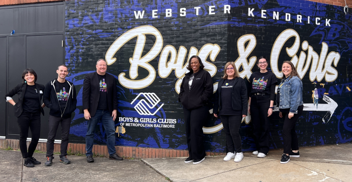 Smithsonian Staff posing in front of Webster Kendrick Boys and Girls Club in Baltimore