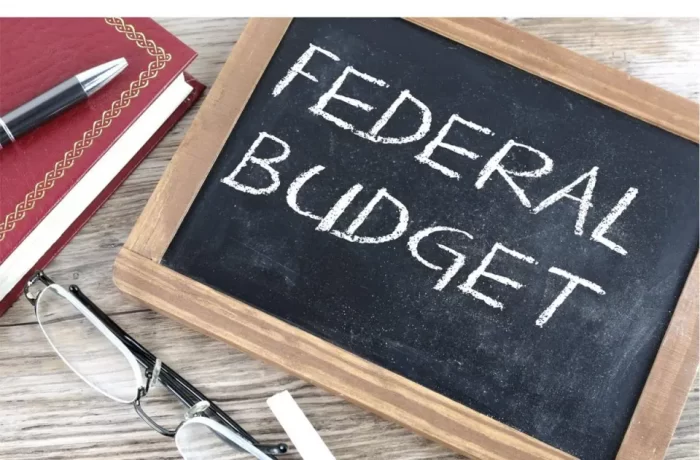 Stock image showing "Federal Budget" written on student's old-fashioned slate
