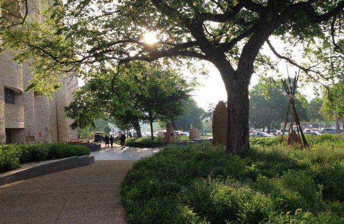 Pathway skirting the edge of garden and sculpture installation at NMAI