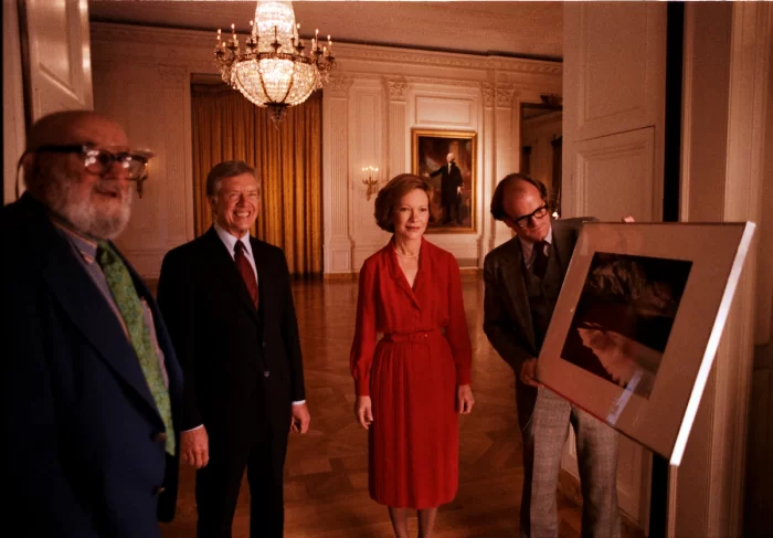 Jimmy and Rosalyn Carter pose for a photo with Ansel Adams after a portrait sitting