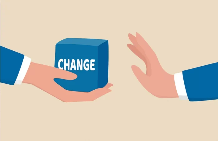 Clip art showing one hand offering a box labled change to another