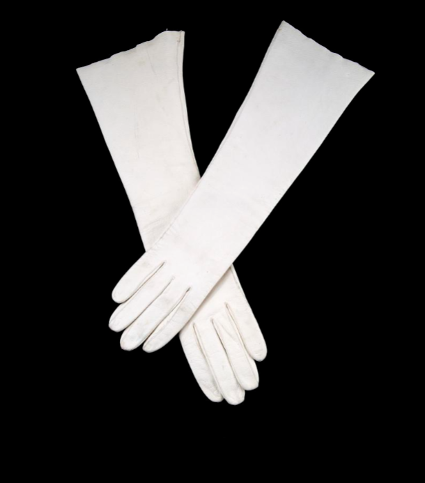 White evening gloves photographed on a black background