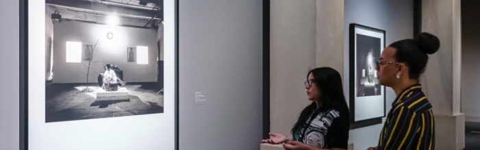 Women viewing artworks in a gfallery