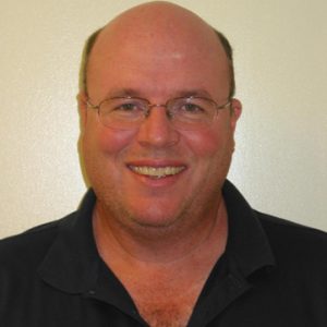 Head shot of William McShea against a neutral background
