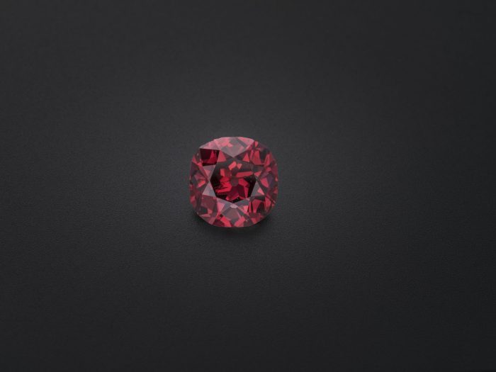 Red diamond on black background
