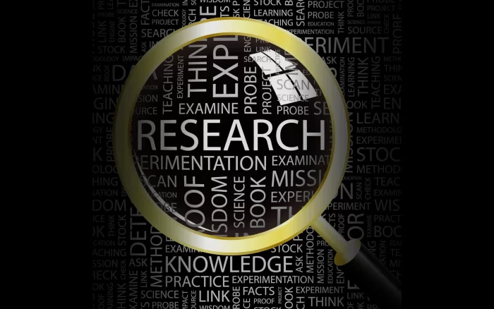 AI art of magnifying glass focused on word "research"