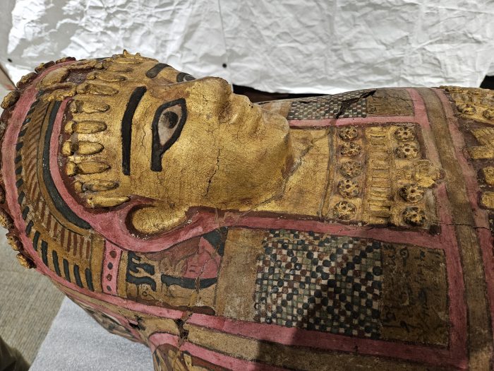 Egyptian sarcophagus painted in gold, red and blue