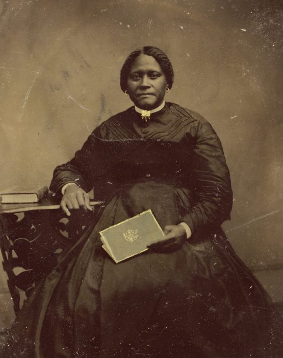 Unidentified African American woman holding what looks like a prayer book